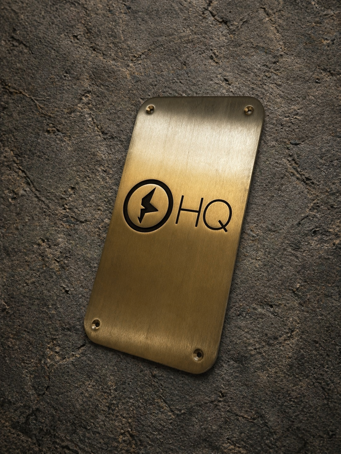 Custom brass business sign with engraved company logo mounted on wall