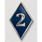 A diamond-shaped house number plaque with a textured dark blue center, silver metallic border, and a raised silver number 2, mounted on a white textured wall.