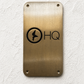 Custom brass business sign with engraved company logo mounted on wall