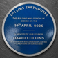 Modern blue heritage plaque with brushed silver border and raised lettering mounted on exterior wall