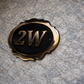 Cast bronze oval house number sign with decorative edge and raised lettering 