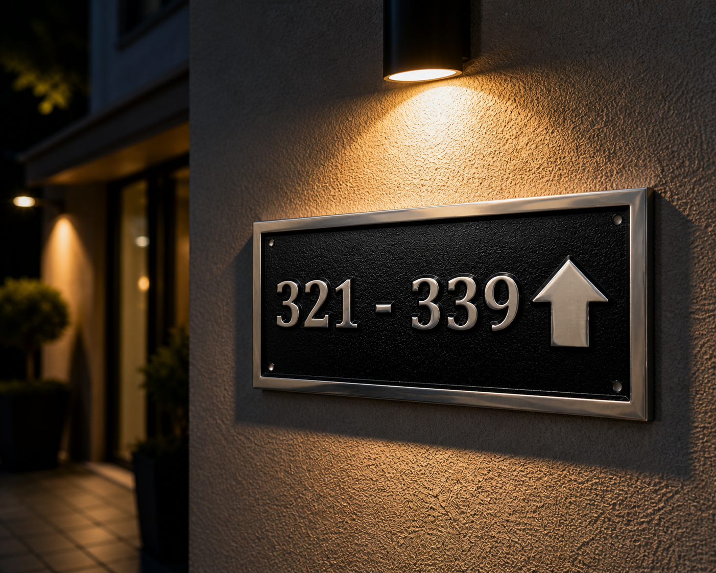 Cast aluminium directional sign with custom text and arrow for hotel or office wayfinding