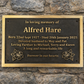 Cast bronze rectangle memorial plaque with satin finish, raised lettering and floral detail