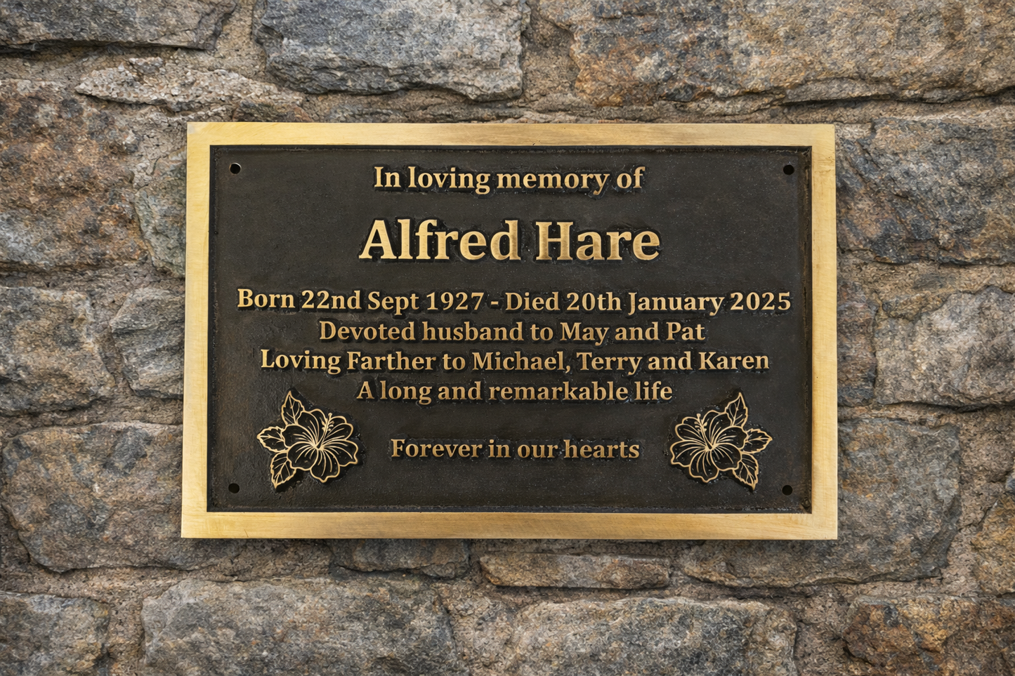 Cast bronze rectangle memorial plaque with satin finish, raised lettering and floral detail