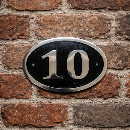 Cast aluminium oval house number sign with raised numerals and border