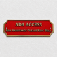 A red ADA Access sign with gold lettering and a gold border, mounted on a textured white wall. The sign reads 'ADA ACCESS' and 'FOR ASSISTANCE PLEASE RING BELL'.