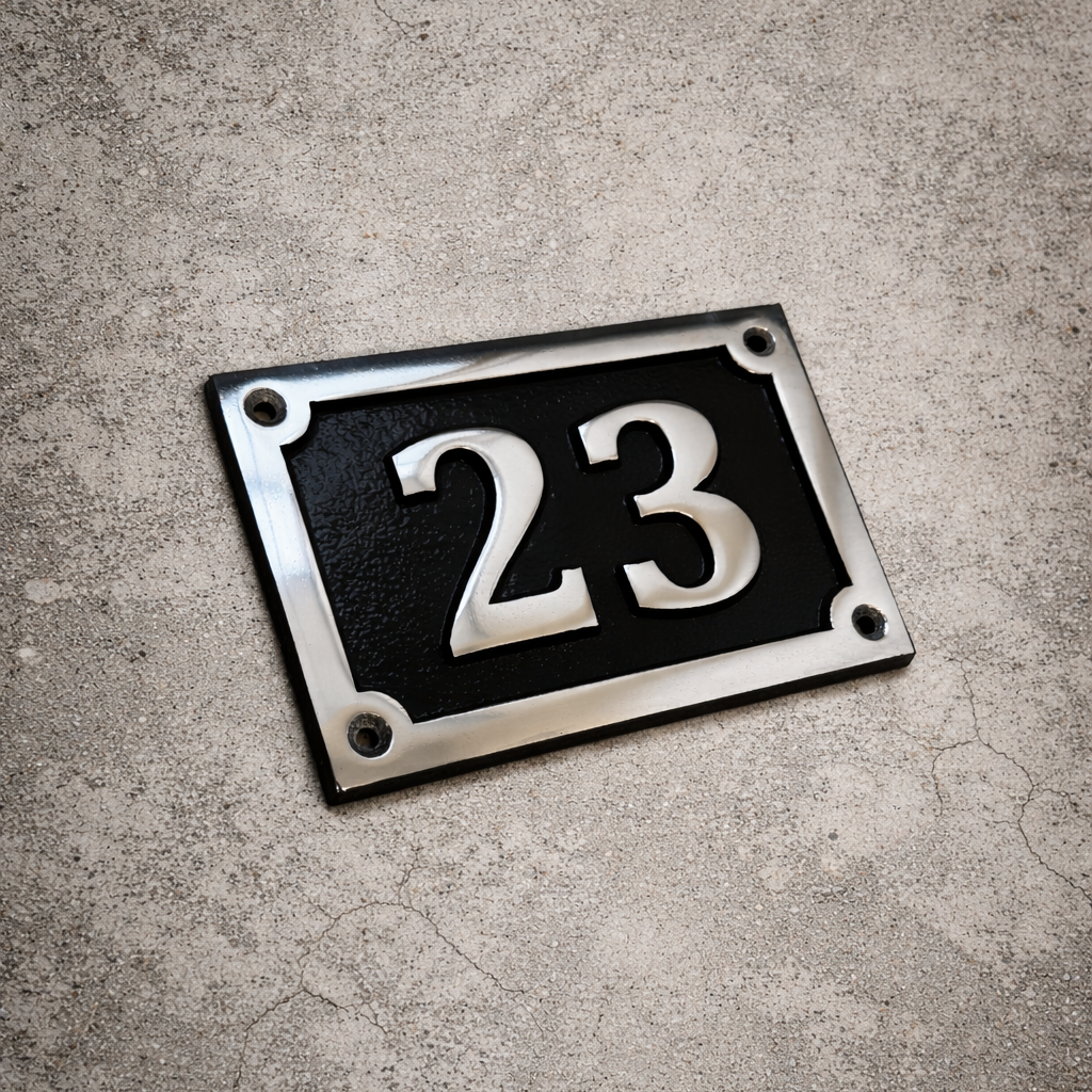 Cast aluminium rectangle house number sign with polished raised numbers and decorative border