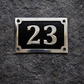 Cast aluminium rectangle house number sign with polished raised numbers and decorative border