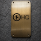 Custom brass business sign with engraved company logo mounted on wall