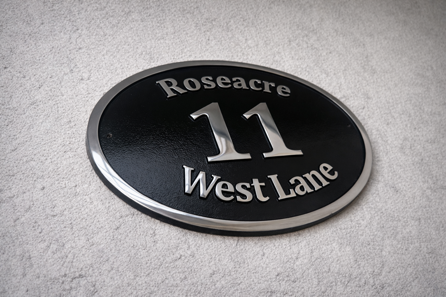 Cast aluminium oval house sign with custom name and number - black