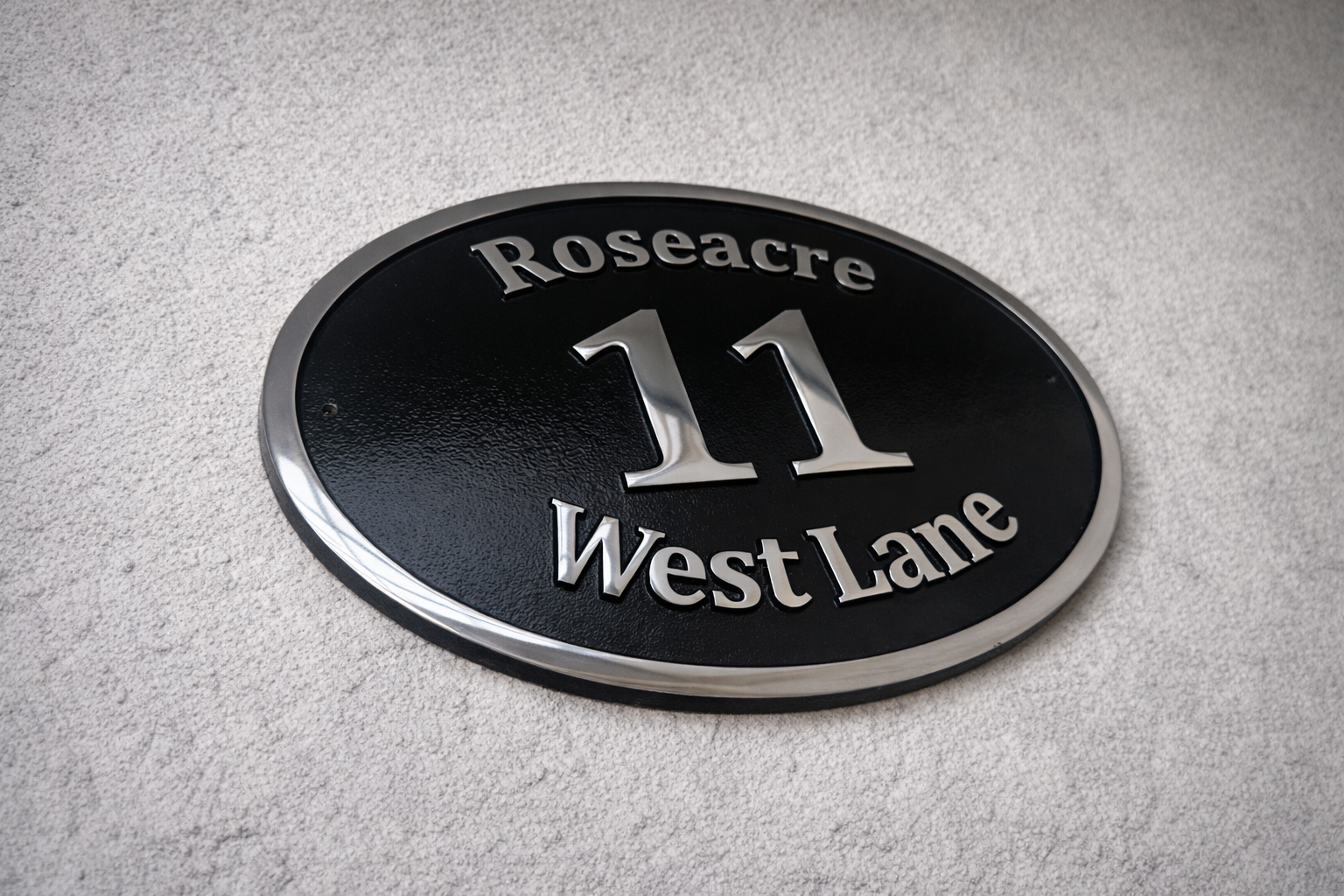Cast aluminium oval house sign with custom name and number - black