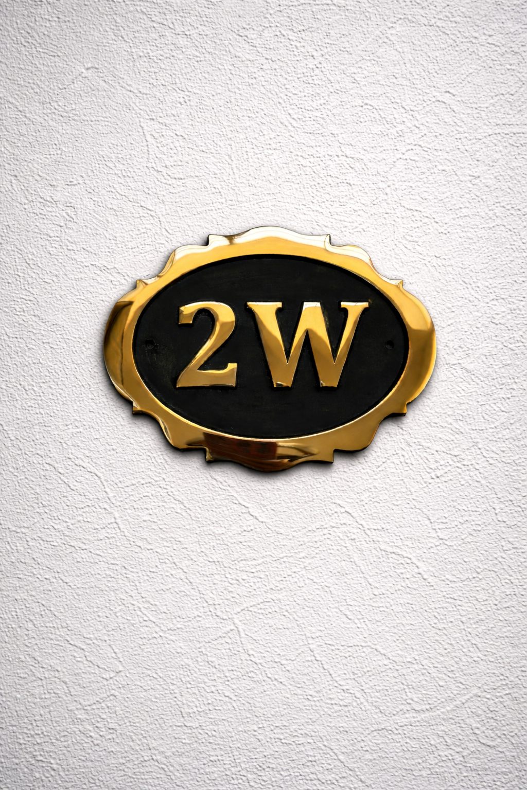 Cast bronze oval house number sign with decorative edge and raised lettering 