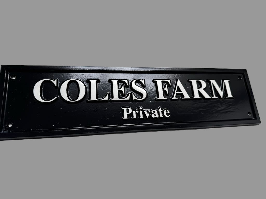 Black and white cast plaque