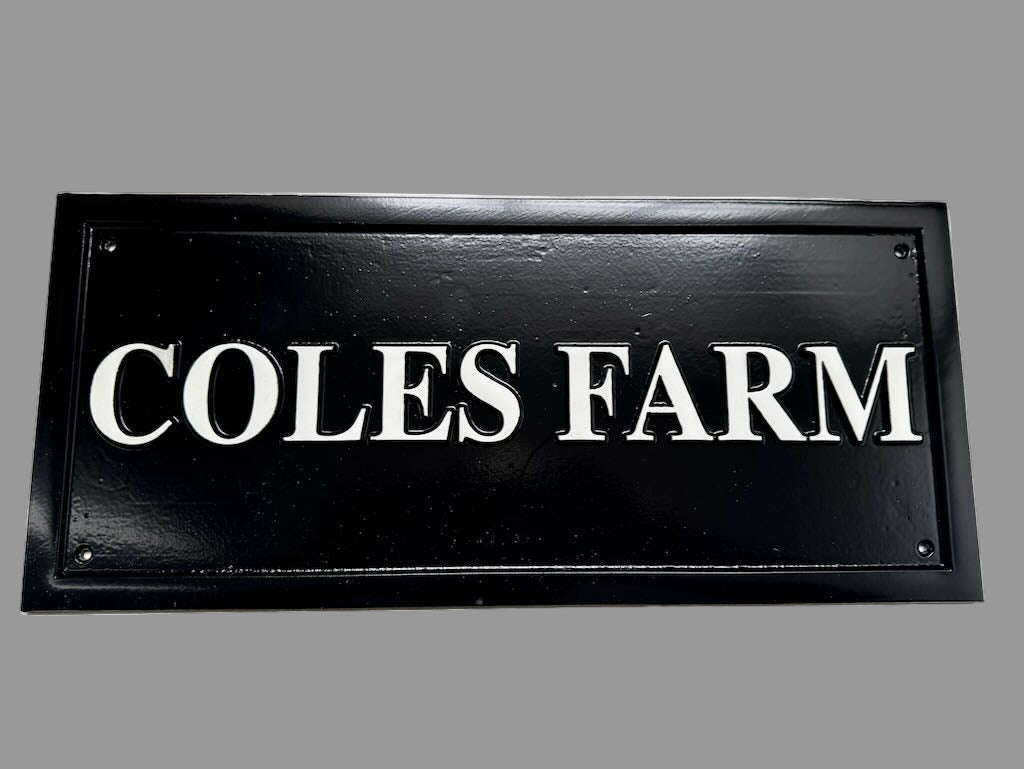 Black and white cast plaque