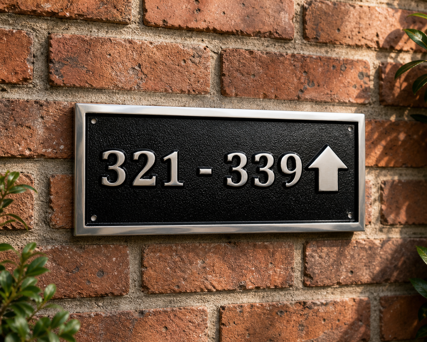 Cast aluminium directional sign with custom text and arrow for hotel or office wayfinding