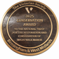 Cast bronze circular heritage plaque with raised lettering mounted on exterior wall