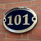 House number sign in oval 