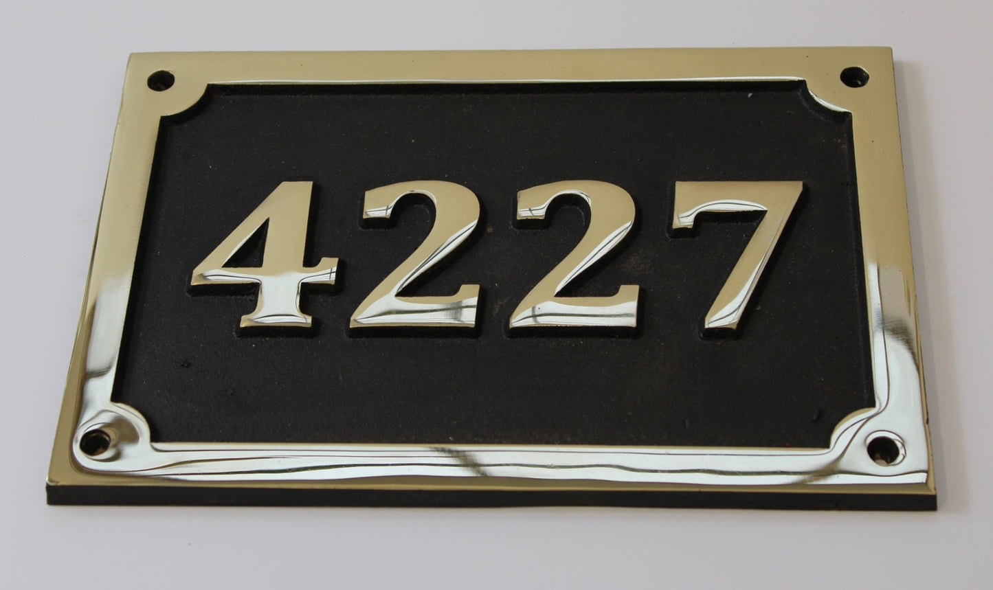 house number sign in bronze