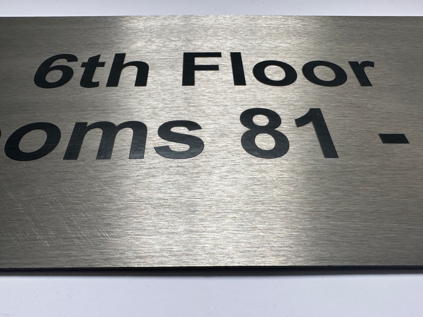 brushed steel sign