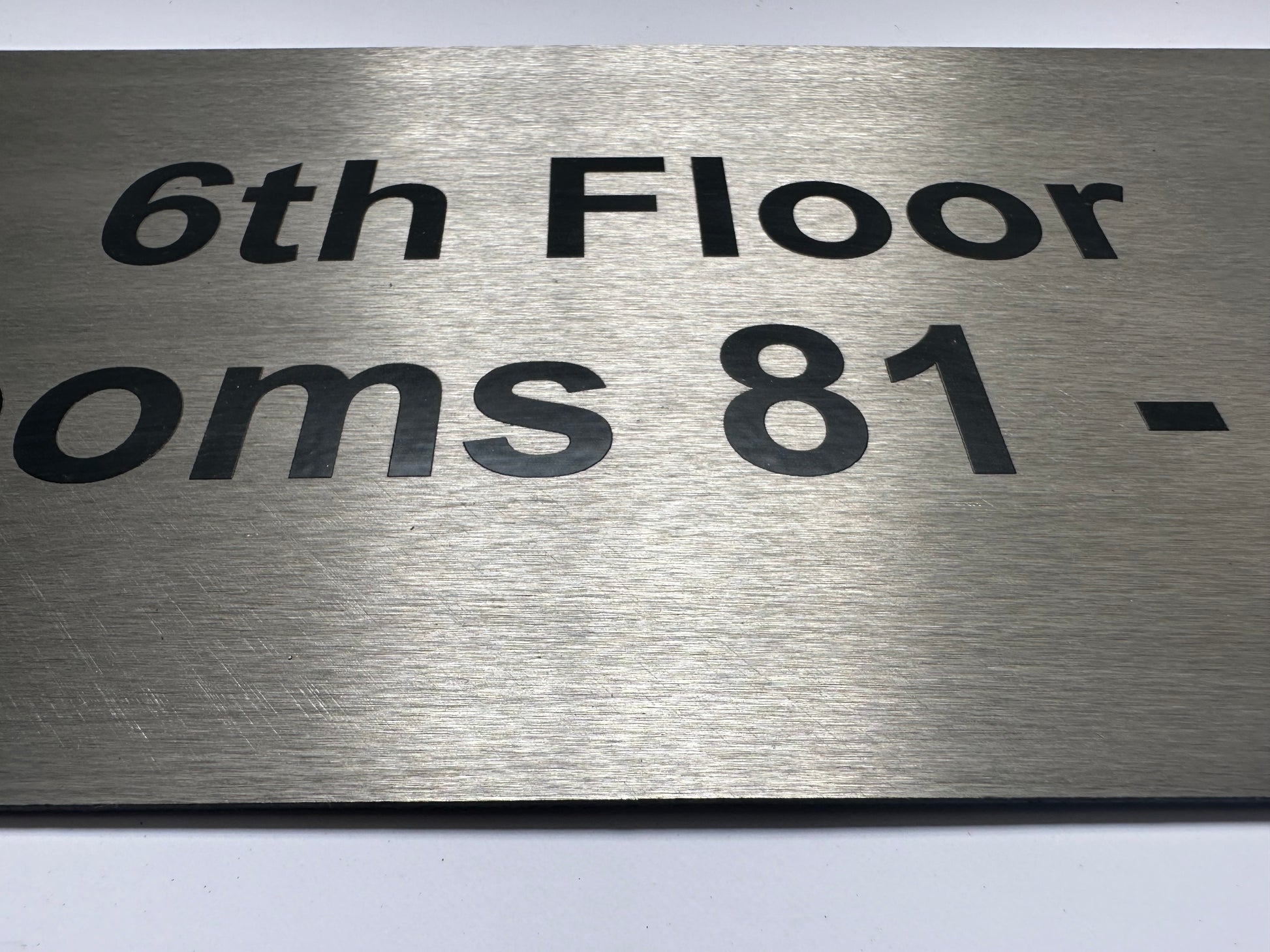 brushed steel sign