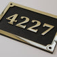 house number sign in bronze