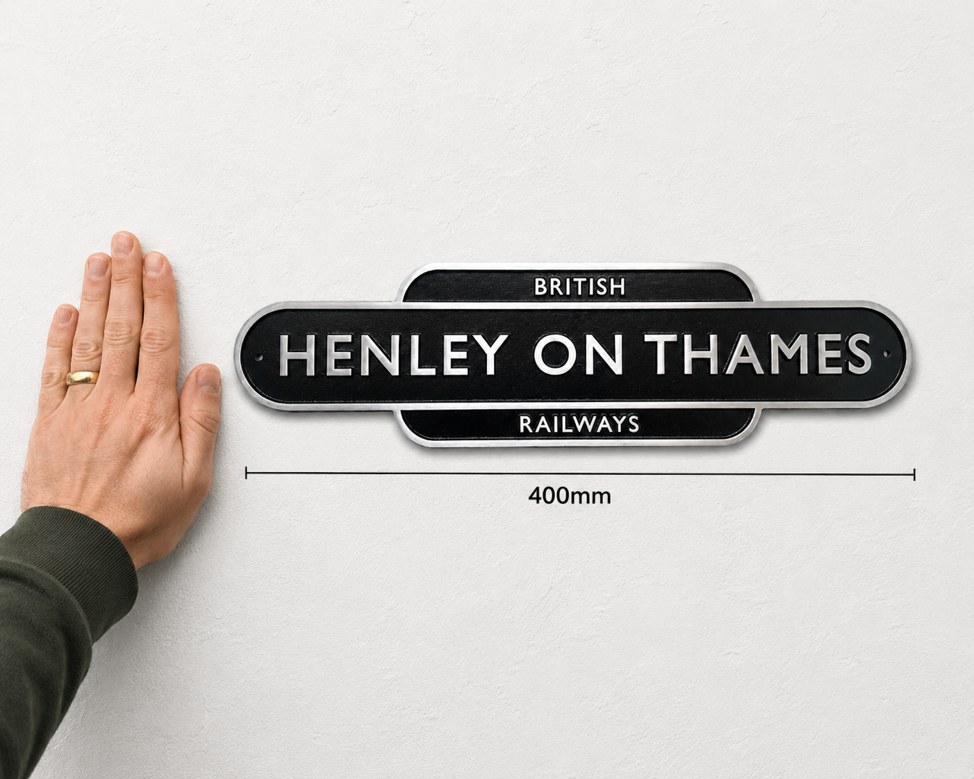 A black and silver British Henley on Thames Railways sign shown against a light gray wall, with a hand touching the left side for scale and a dimension marker reading 400mm below.