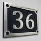 House number sign dark blue background 