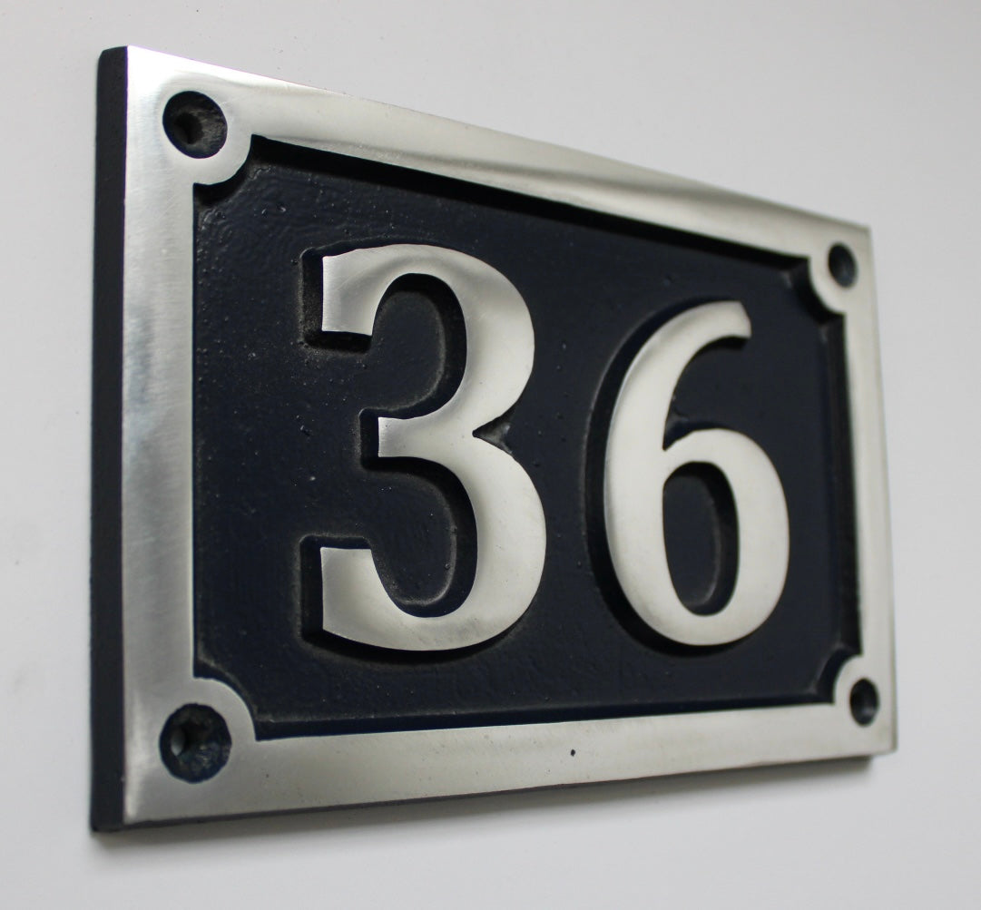 House number sign dark blue background 