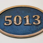 House number sign in Cast Copper blue background 