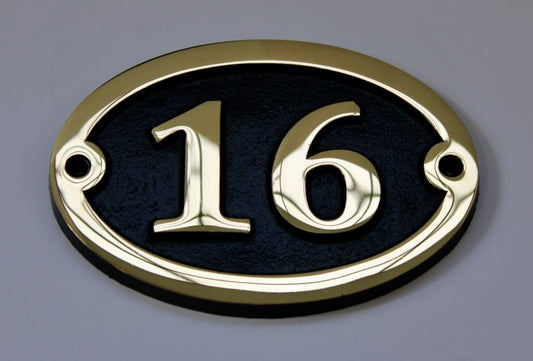 house number sign in bronze oval shape