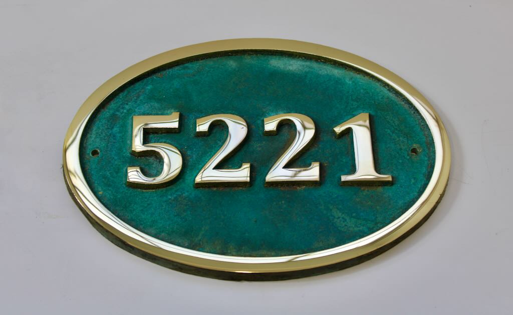 House number sign oval in bronze with Verdigris background