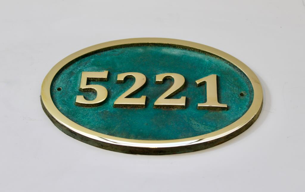 House number sign oval in bronze with Verdigris background