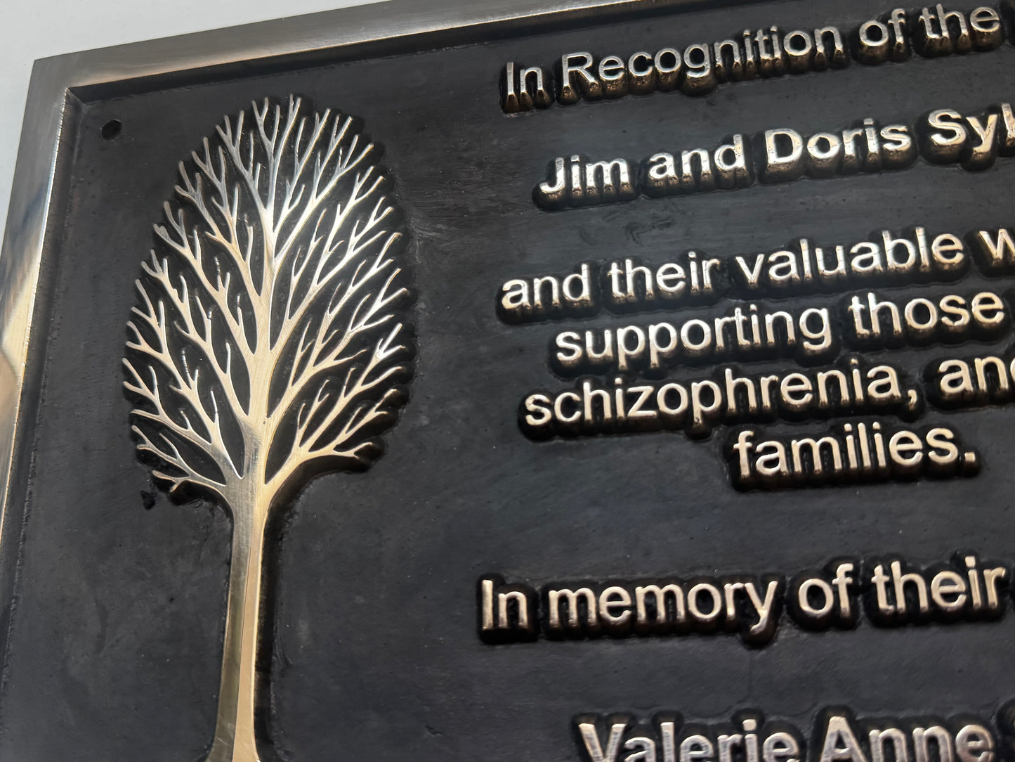 Cast bronze rectangle memorial plaque with polished finish