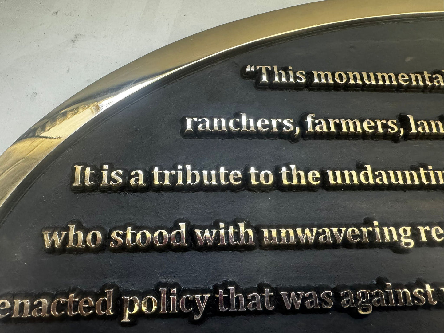 Plaque with engraved text on a metallic surface