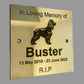Memorial plaque for a dog named Buster on a gray background