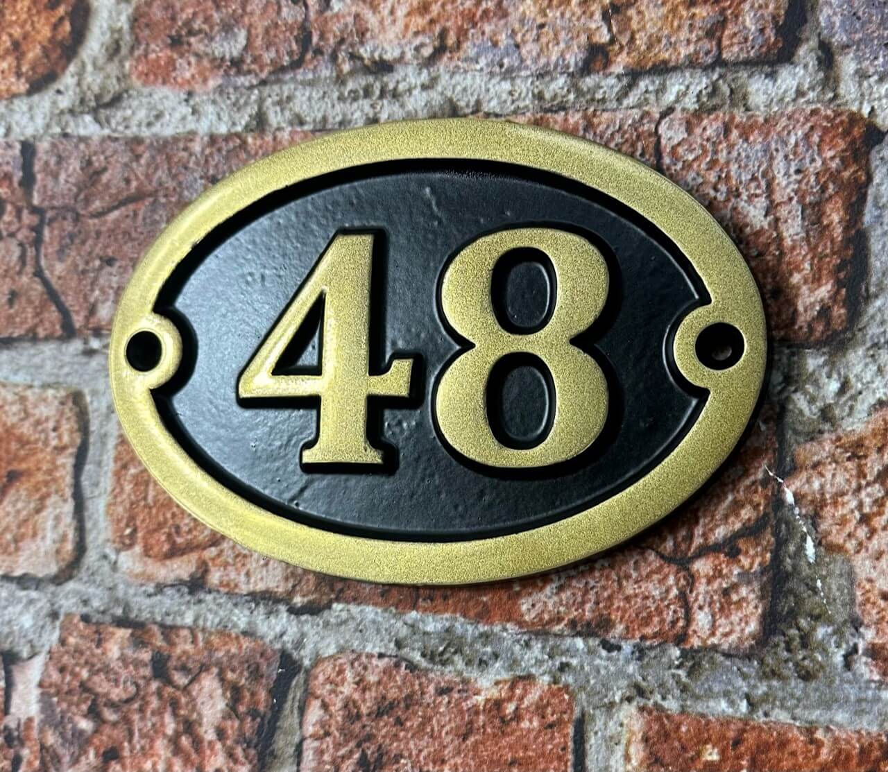 Aluminium number sign with gold painted number and text