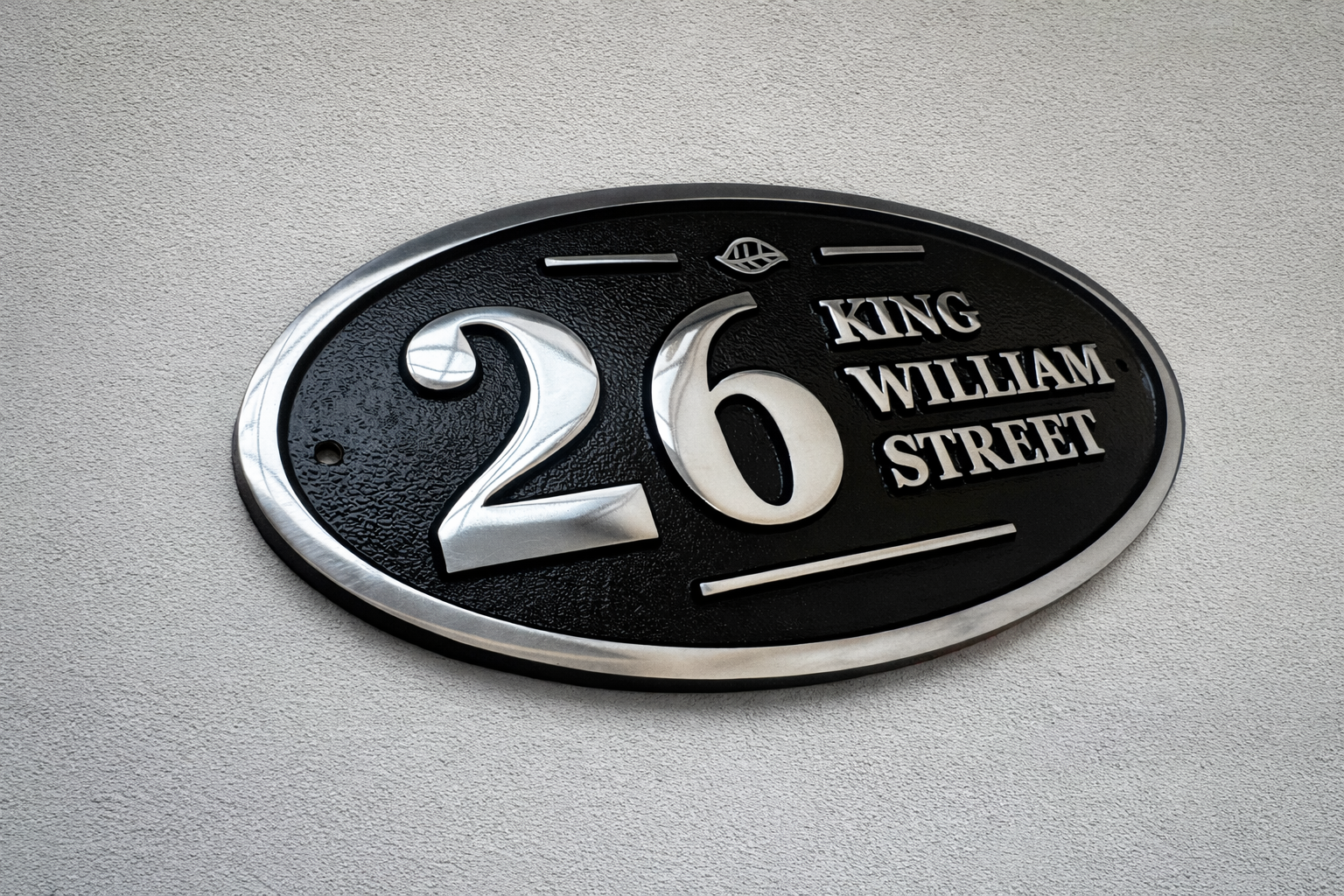 Wide oval aluminium house sign custom cast address plaque on wall