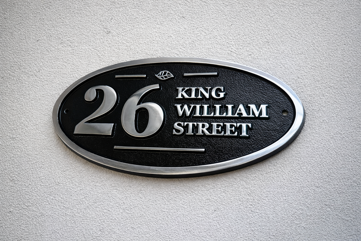 Wide oval aluminium house sign custom cast address plaque on wall