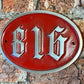 Numbered wall sign traditional style oval red
