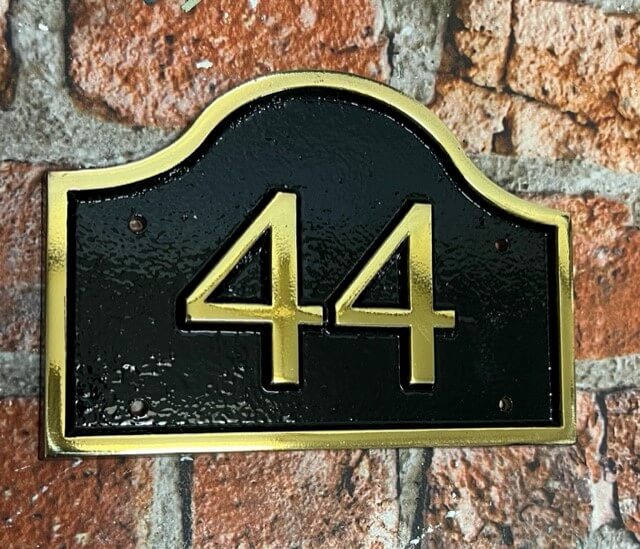 brass house number sign