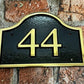 brass house sign with number