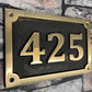 Cast House Sign in Bronze with patina background
