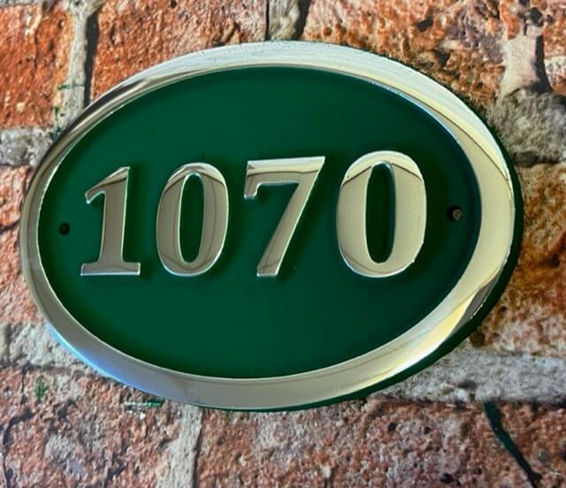 House number sign in aluminium green