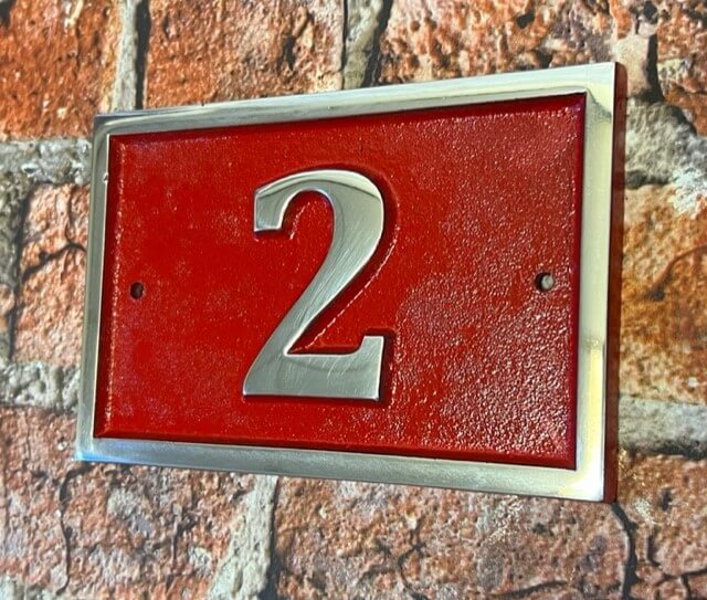 house number sign in aluminium red background