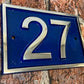Modern door number sign in blue