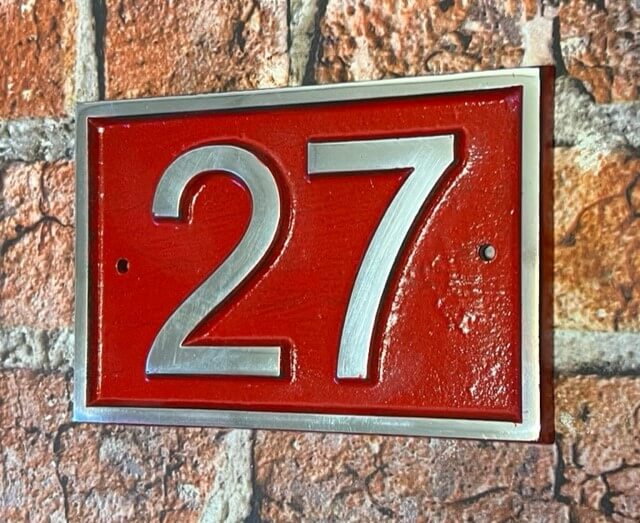 Modern door number sign in red