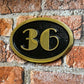 house number sign art deco black background