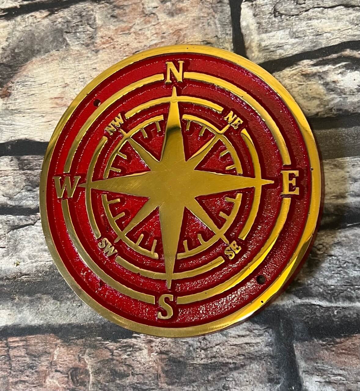 bronze compass in red