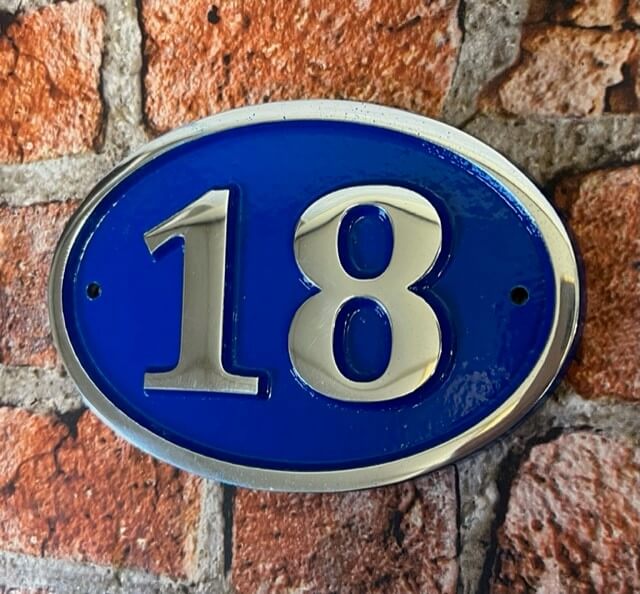 house number sign oval blue background
