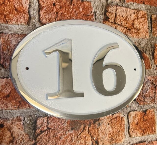 house number sign oval white background